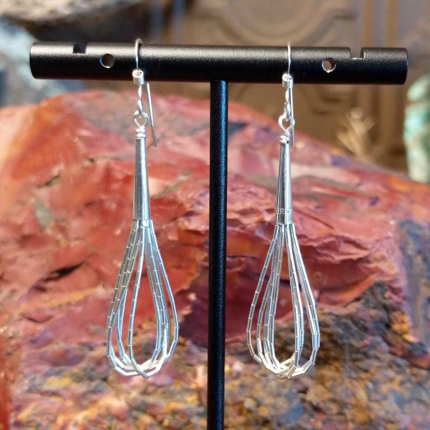 Five strands of sterling silver beaded together to create the earrings.