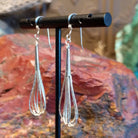 Five strands of sterling silver beaded together to create the earrings.