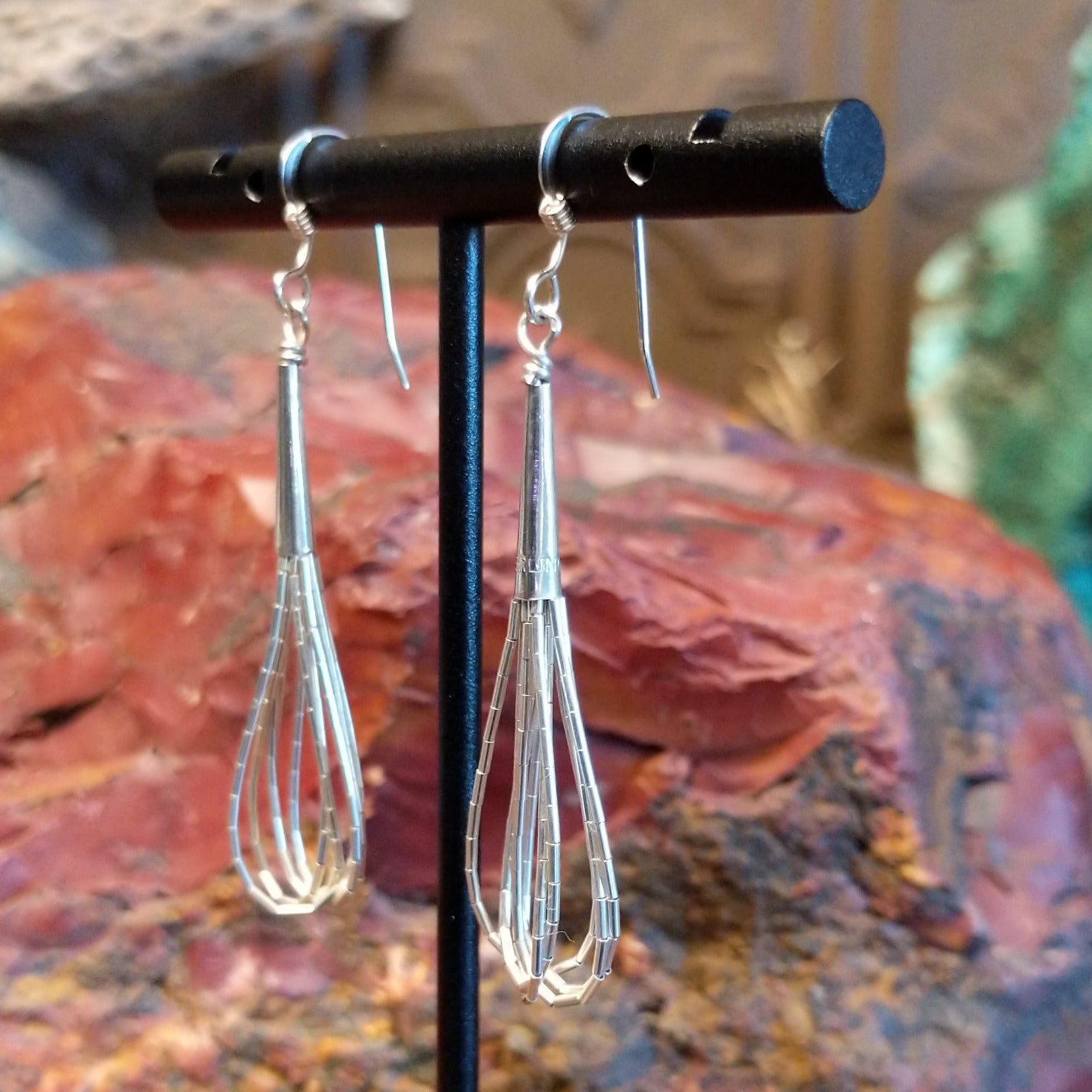 Five strands of sterling silver beaded together to create the earrings.