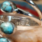 Close-up of the artisan's stamped signature.