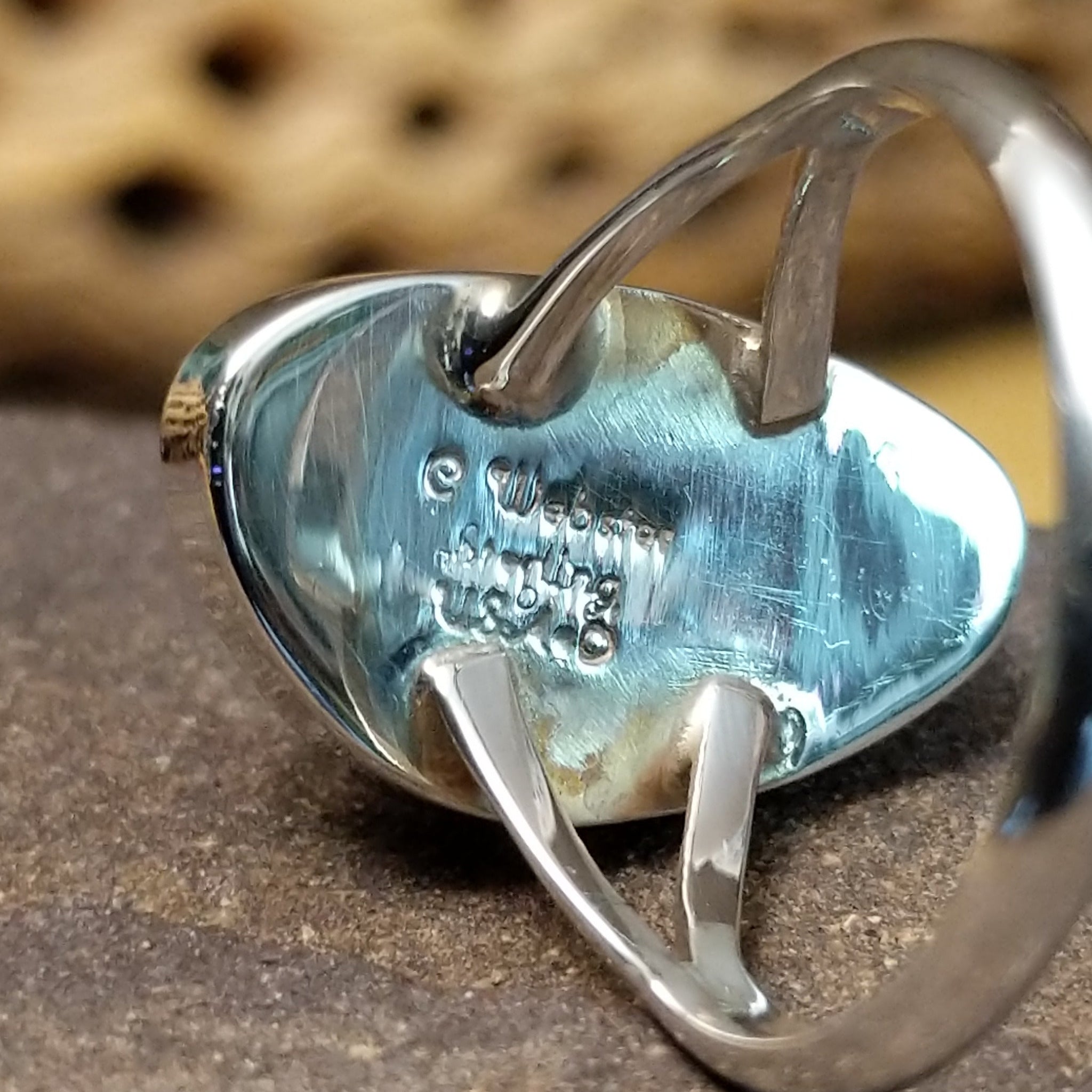 Abstract lapis ring by Cathy Webster, featuring a deep blue lapis stone with natural pyrite flecks set in a handcrafted sterling silver contemporary design.  Artisan and Sterling Silver stamp.