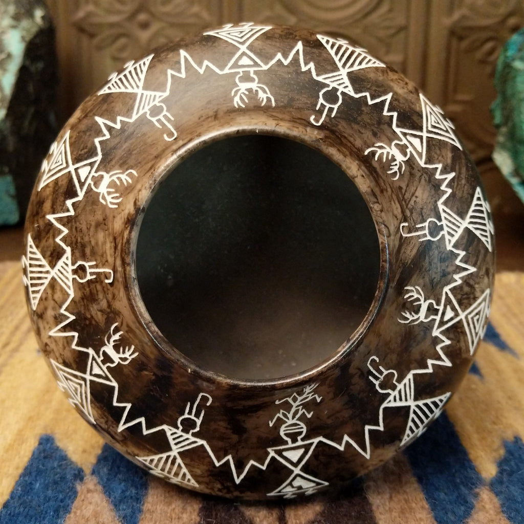 The smooth lip of the piece and hollow interior.