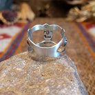 Sterling silver ring with coral centerpiece set in the bezel and open concept design of the band.