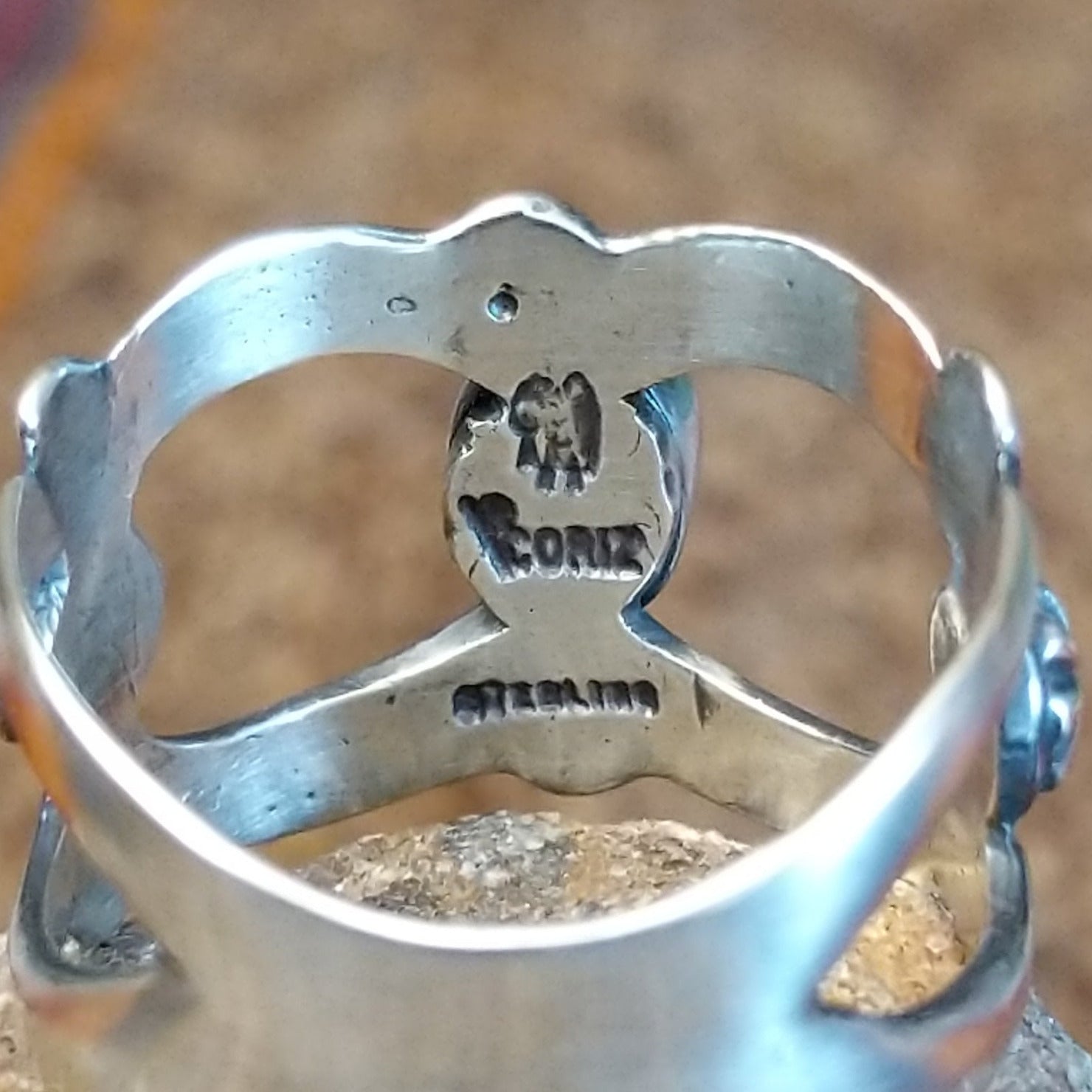 Close-up of the artisan's stamped signature.