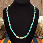 Alternating Sonoran Gold turquoise beads, strung together on the sterling silver chain of the necklace.
