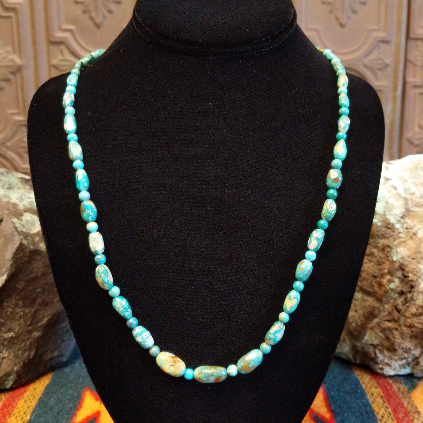 Alternating Sonoran Gold turquoise beads, strung together on the sterling silver chain of the necklace.