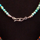 Close-up of the hook clasp on the necklace.