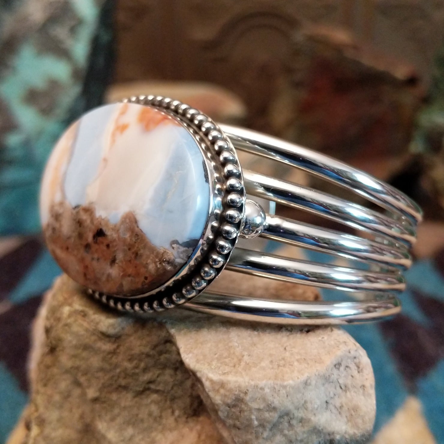 Sterling silver cuff with Arizona blue opal set in the oval bezel, framed by dotted accents.