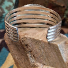 Sterling silver cuff with Arizona blue opal set in the oval bezel, framed by dotted accents.