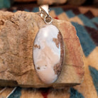 Sterling silver pendant with Arizona blue opal set in the oval bezel.