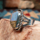 Sterling silver ring with Arizona blue opal set in the bezel, framed by dotted accents.