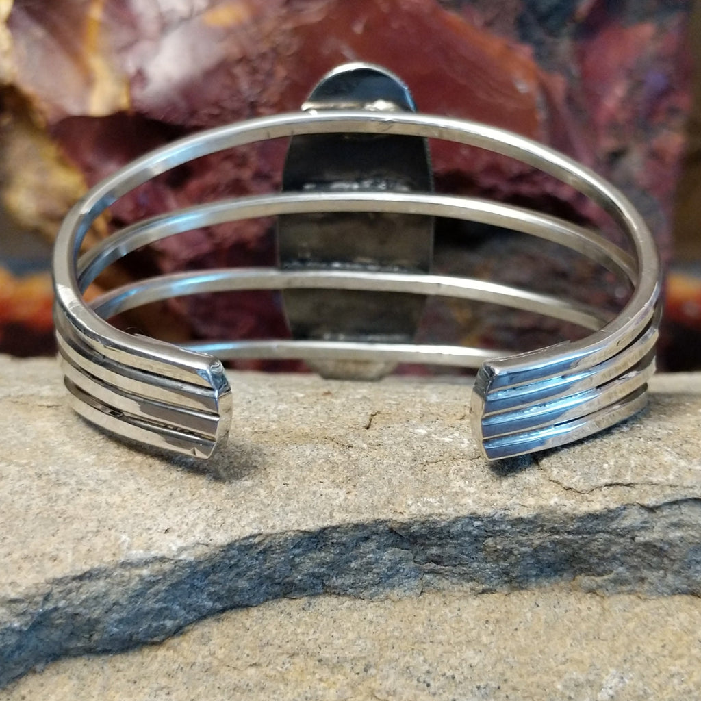 The back reveals the sleek sterling silver multi-band.