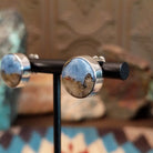 Sterling silver post earrings with Arizona blue opal set in round bezels.