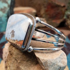 Sterling silver cuff bracelet with Arizona blue opal set in the large bezel, framed by ribbed silverwork.