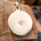 Close-up of the artisan's stamped signature.