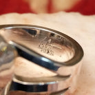 Close-up of the artisan's stamped signature.