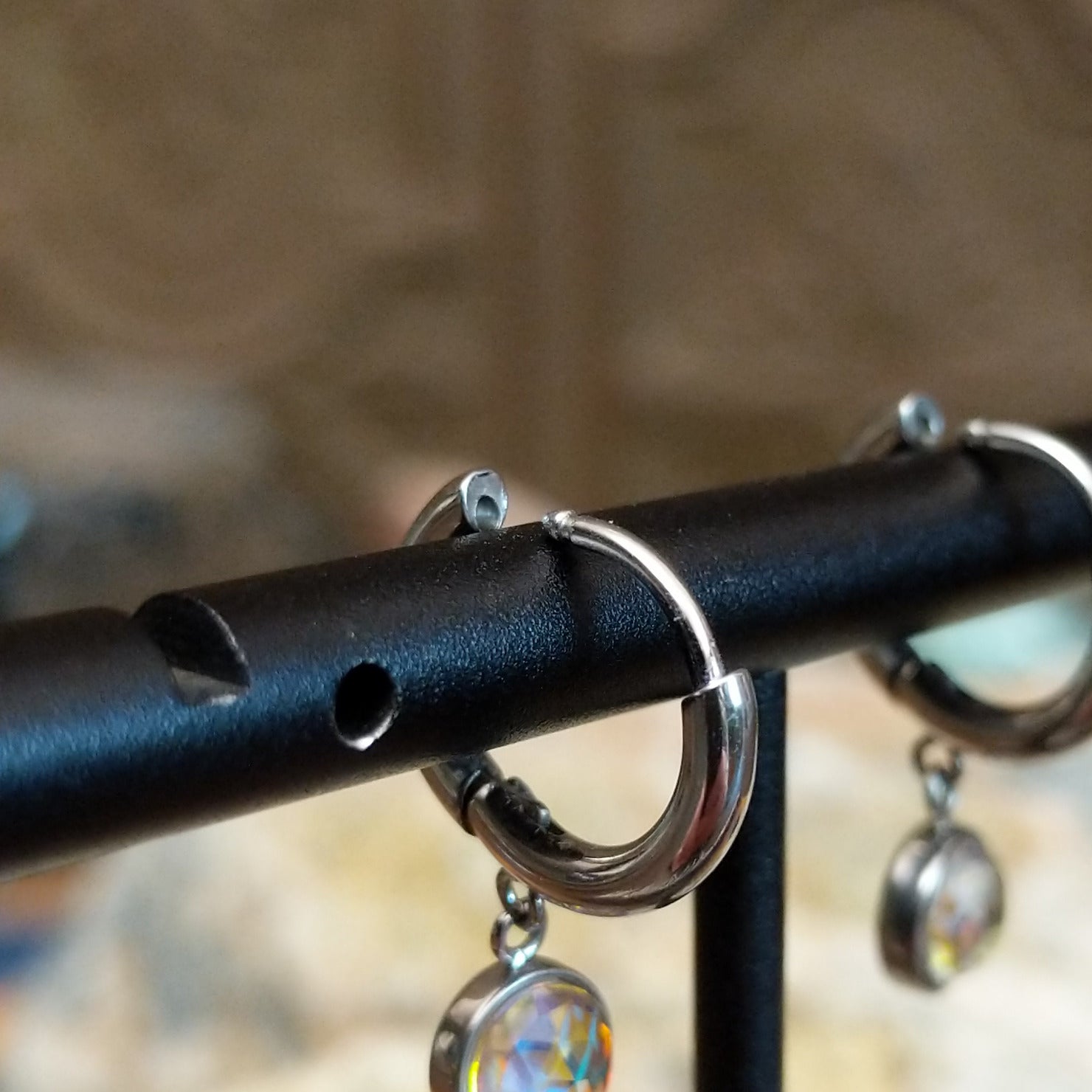 Aurora lunar hoop earrings by LeightWorks, featuring sparkling faceted crystal accents set within elegant lightweight hoops with brilliant light-reflecting detail. Huggie back - Fire