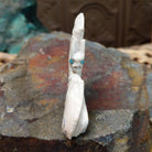 Bat Zuni fetish carving by Derrick Kaamasee with engraved wings, natural gray matrix, and turquoise inlaid eyes.