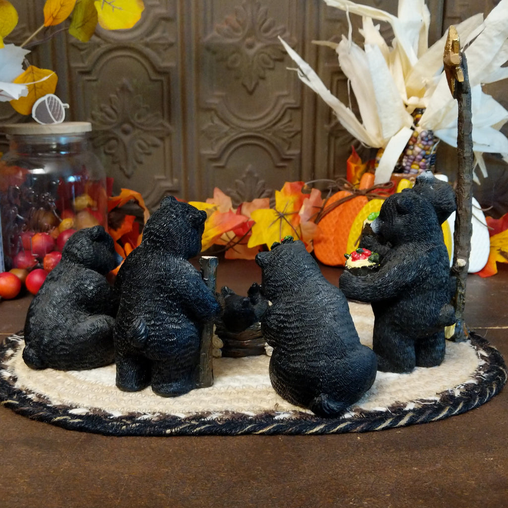 Resin black bears depicting a nativity scene with detailed paints.