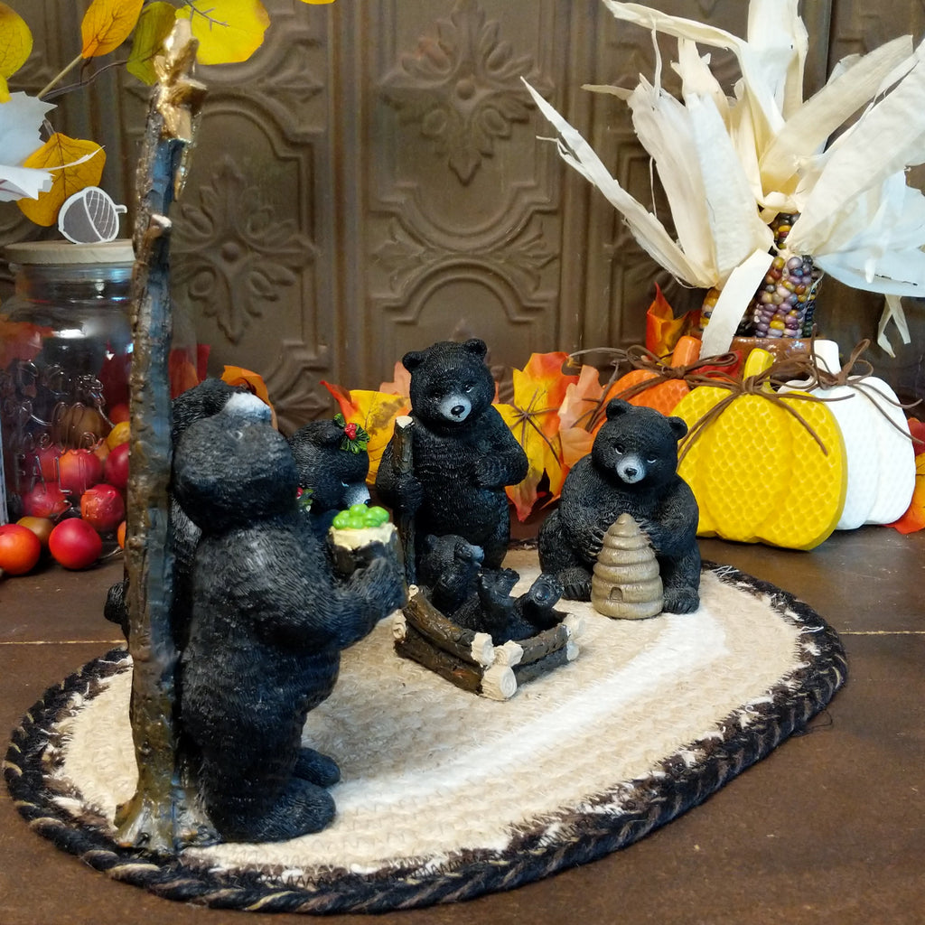 Resin black bears depicting a nativity scene with detailed paints.
