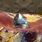 Sterling silver ring with bear paw signet centerpiece.