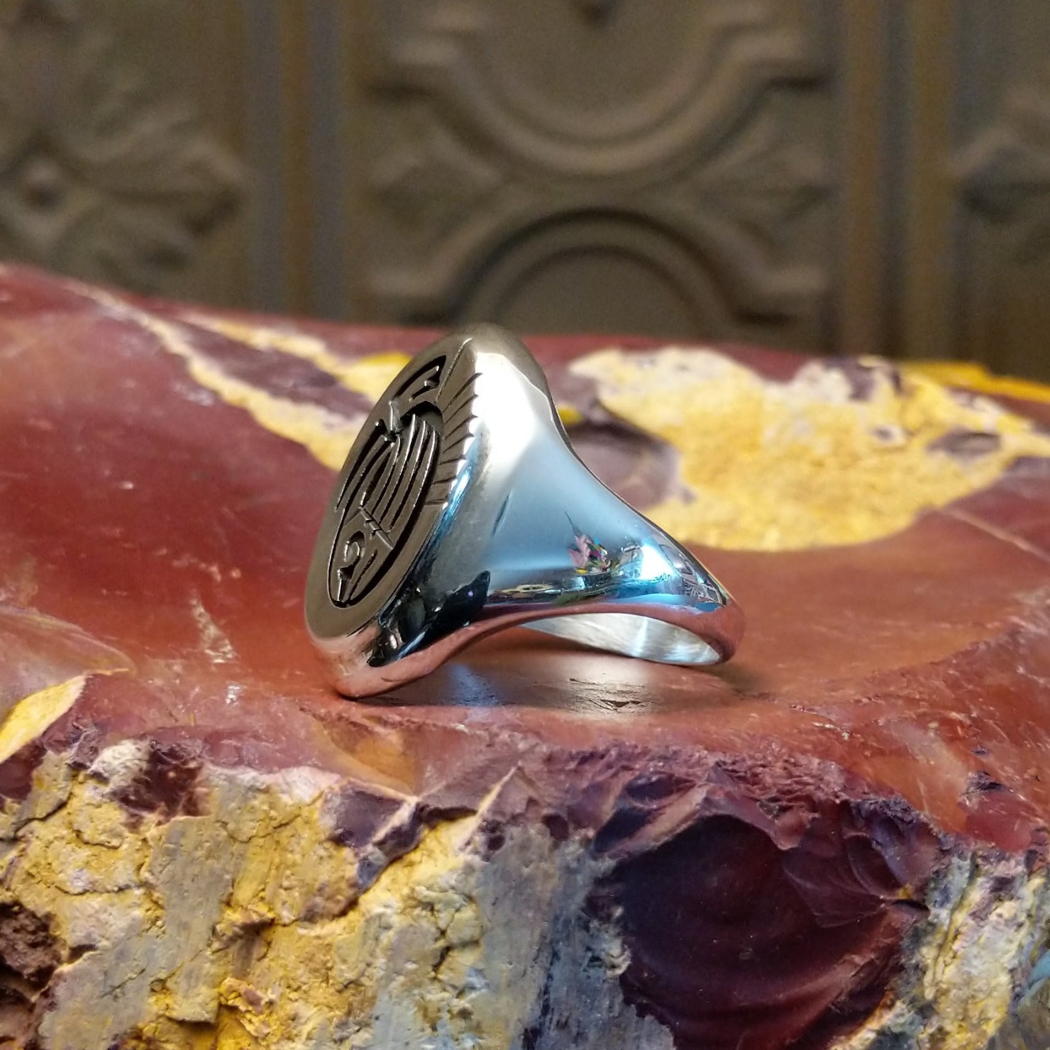 Sterling silver ring with bear paw signet centerpiece.
