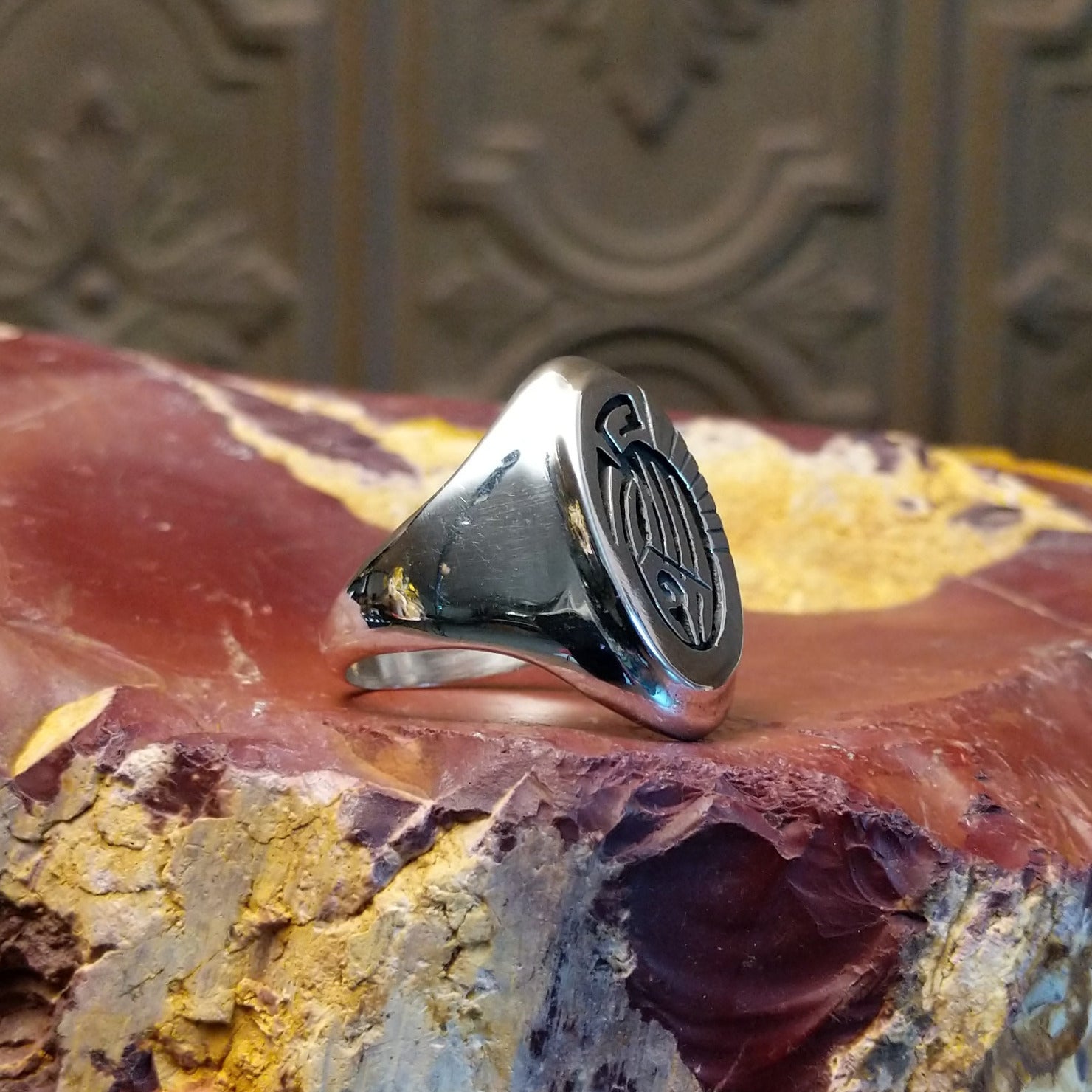 Sterling silver ring with bear paw signet centerpiece.