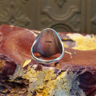 Sterling silver ring with bear paw signet centerpiece.