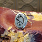 Sterling silver ring with bear paw signet centerpiece.