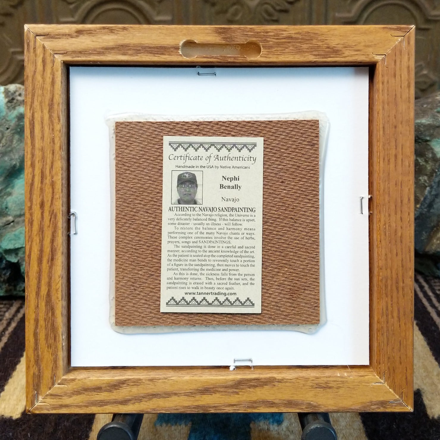 Backside of the Bird Yei sand painting, showing the Certificate of Authenticity and Artist information. 
