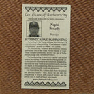 Close up of the Certificate of Authenticity and Artist information. 