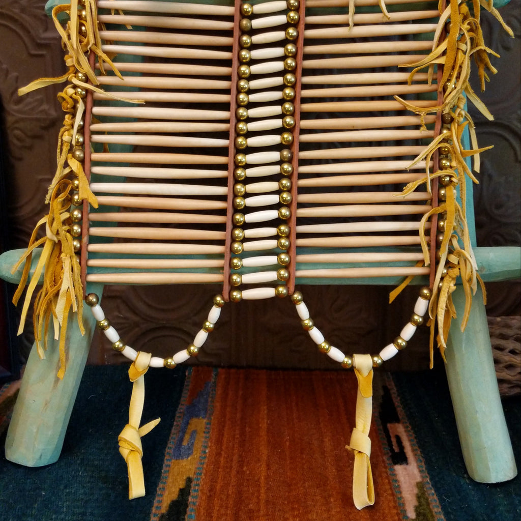 Close-up of the white and brass beads.