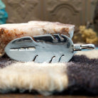 Close-up of the artisan's stamped signature.