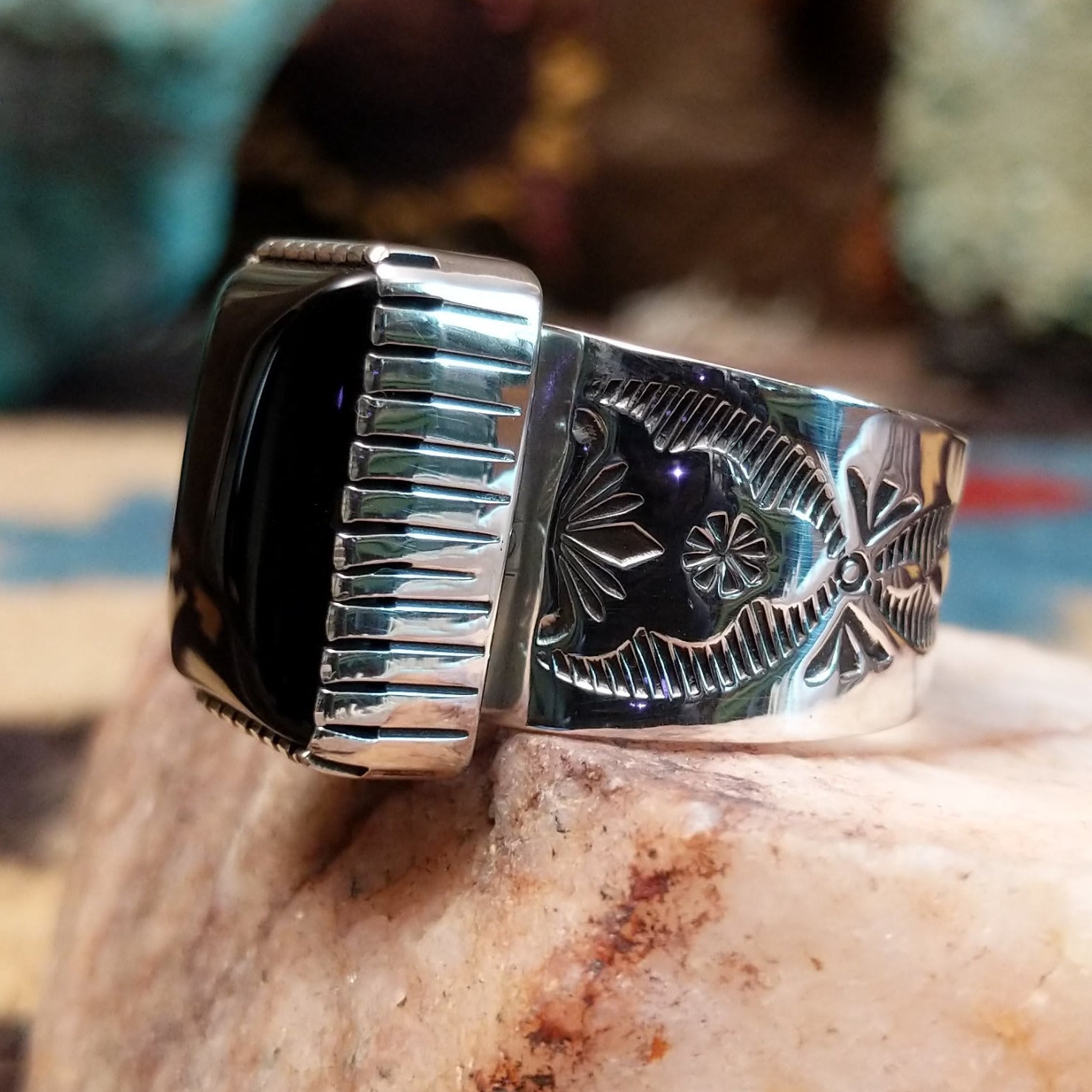 Sterling silver ring featuring Southwestern hand-stamping and black onyx.