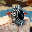 Sterling silver ring with black onyx set in the bezel, framed by twisted rope and unique silverwork.