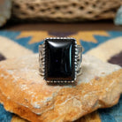 Handcrafted Navajo sterling silver ring by Murphy Platero featuring a polished black onyx cabochon set in a traditional Southwestern silver setting with a timeless, understated design.