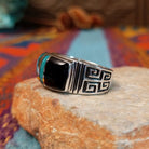Black Onyx & Turquoise Inlay Ring by Kenneth Bitsie featuring polished black onyx and turquoise inlay separated by Sterling Silver channels; side view.