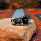 Black Onyx & Turquoise Inlay Ring by Kenneth Bitsie featuring polished black onyx and turquoise inlay separated by Sterling Silver channels; side view.