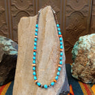 Beaded Blue Gem turquoise and shell necklace strung along the sterling silver chain in a patterned design.