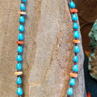 Beaded Blue Gem turquoise and shell necklace strung along the sterling silver chain in a patterned design.