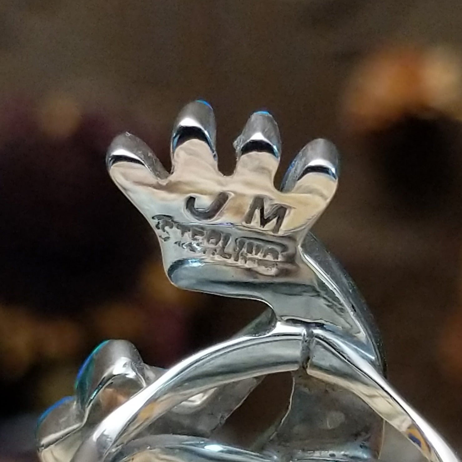 Handcrafted sterling silver ring by James Mason featuring a blue manmade opal and Kokopelli design in a traditional Southwestern Native American style.  Artisan and Sterling Silver stamp.
