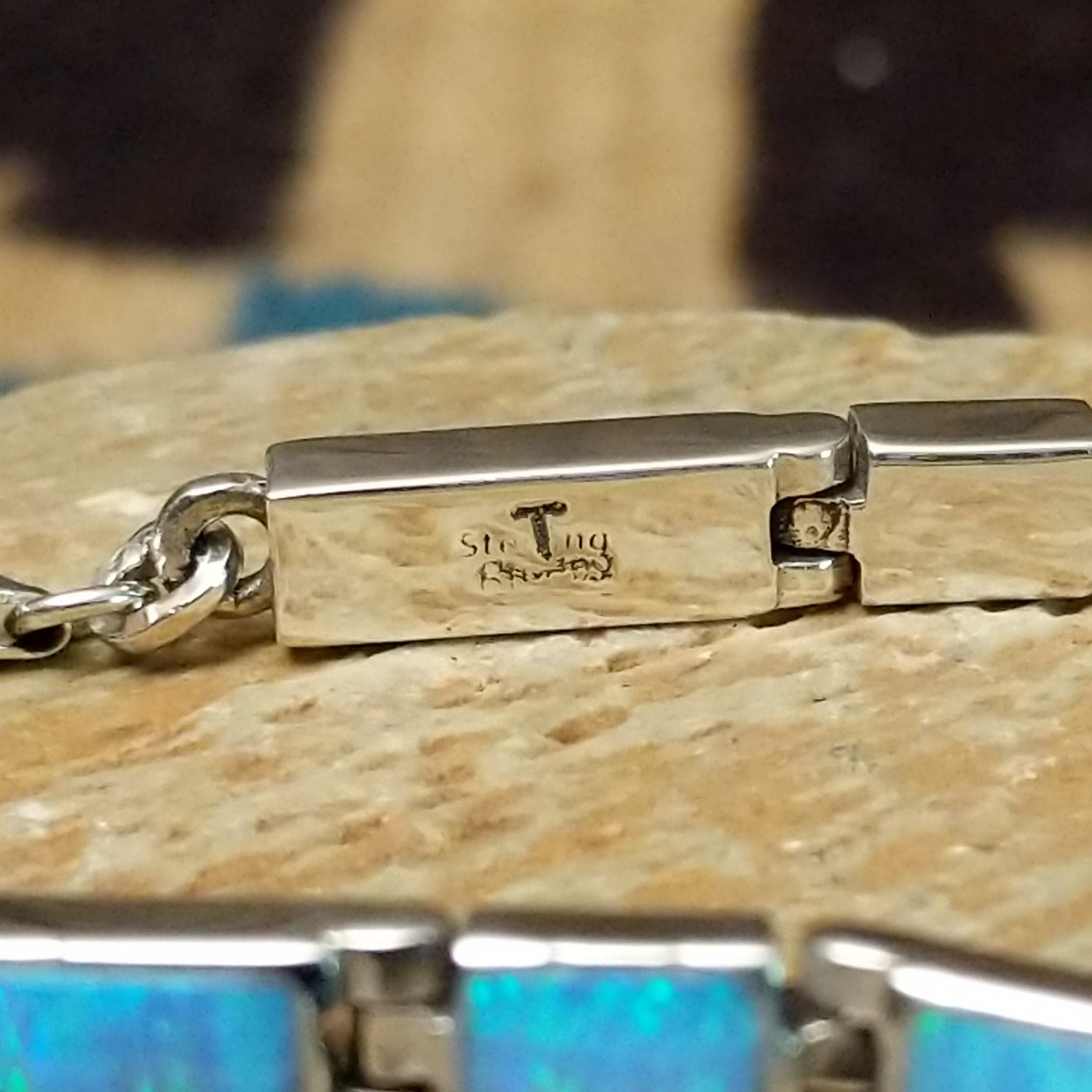 Close-up of the artisan's stamped signature.