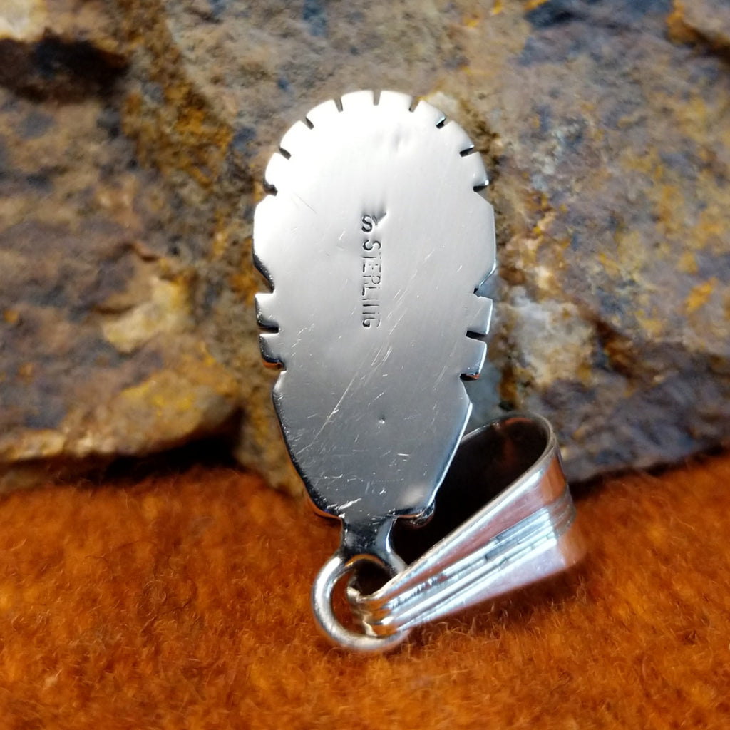 The authentication stamp is found on the back.