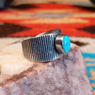 Sterling silver ring with ridged band and Blue Ridge turquoise set in the raised bezel.