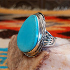 Sterling silver ring with Kingman turquoise set in the large bezel, framed by the stamped setting.