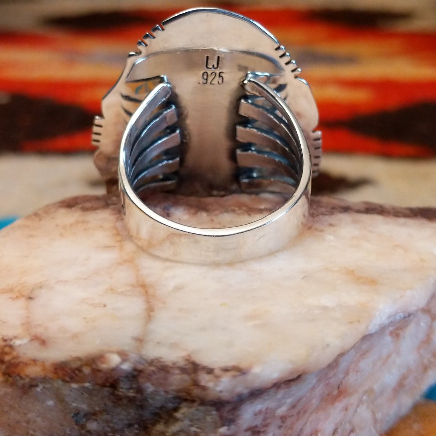 Sterling silver ring with Kingman turquoise set in the large bezel, framed by the stamped setting.