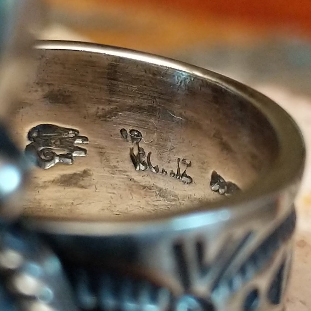 Close-up of Raymond Coriz's stamped signature.