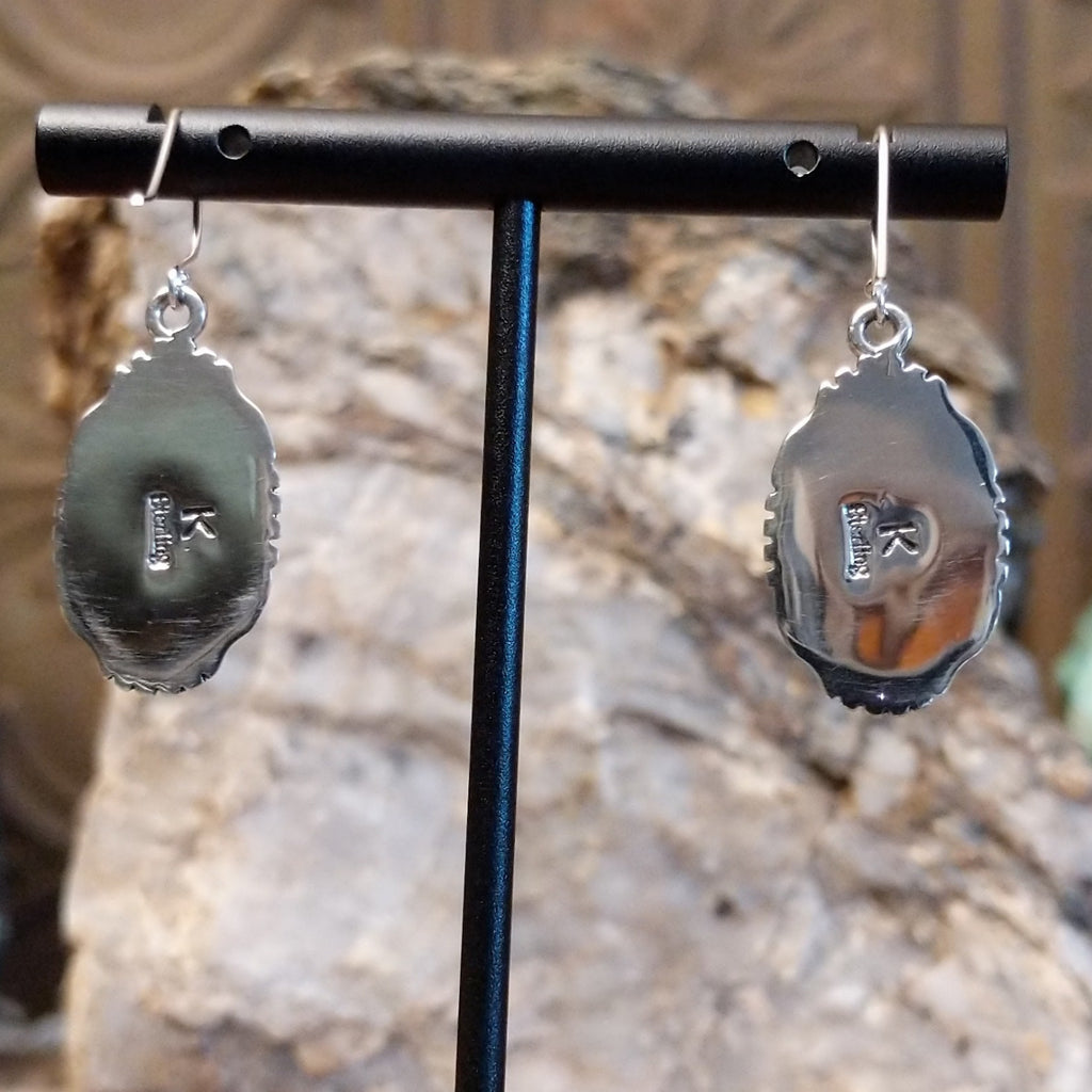 The back features the artisan's stamp.