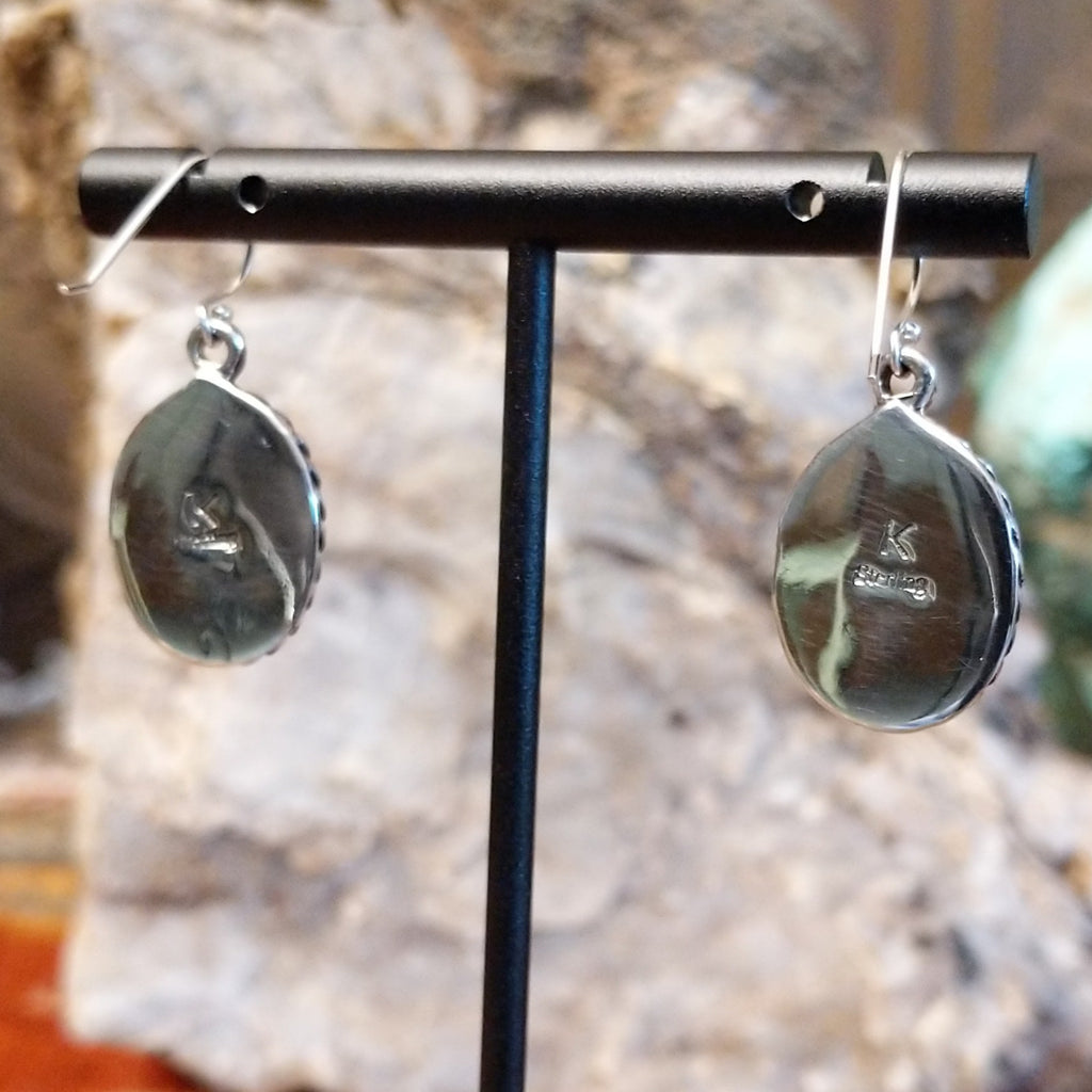 The back features the artisan's stamp.