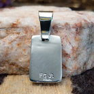 Close-up of the artisan's stamped signature.